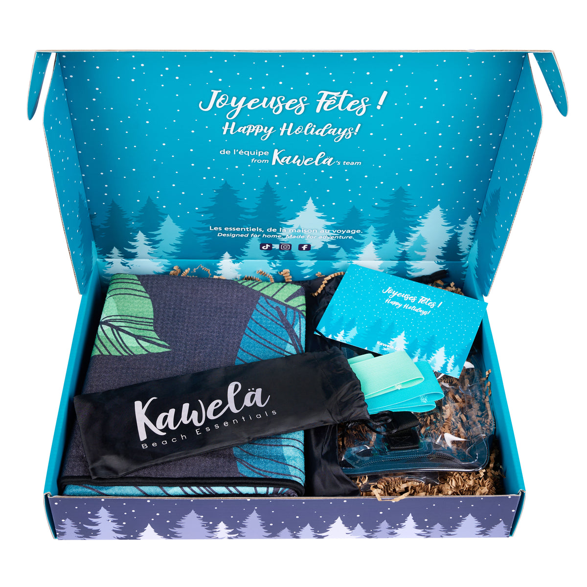 Coffret cadeau Kawelä Escapade au soleil avec produits de beauté et accessoires colorés, présenté dans un emballage élégant.