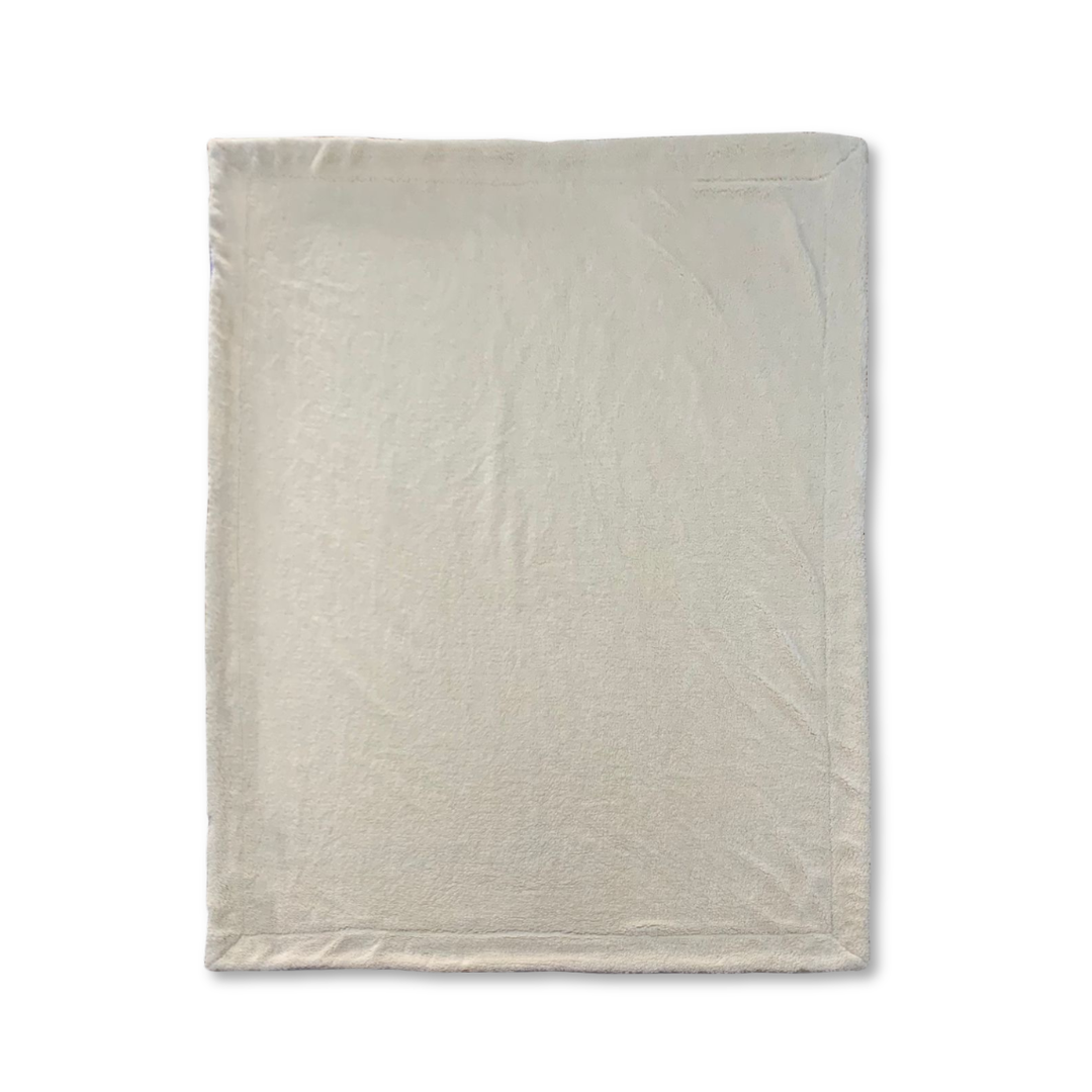 Couverture XL Kawelä CIDER HILL en textile doux, couleur neutre, étendue pour le confort et la chaleur.