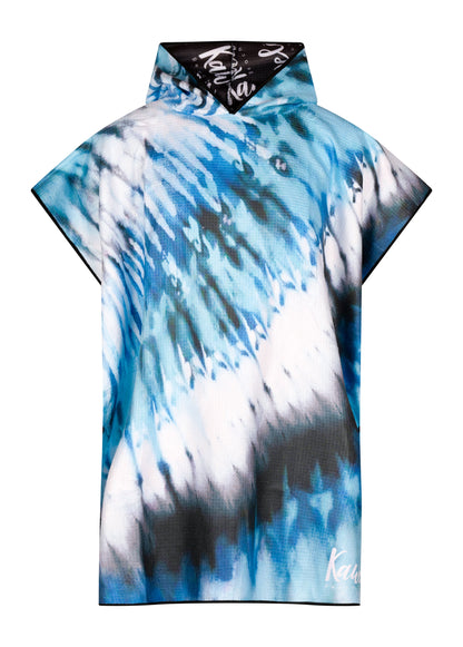 Poncho Acapulco de la marque Kawelä, tissu coloré et léger, porté en extérieur avec motif vibrant.