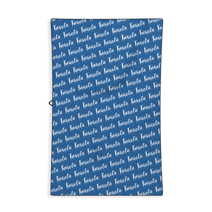 Serviette de plage Capri de la marque Kawelä, vue de dos avec motif coloré et tissu absorbant.