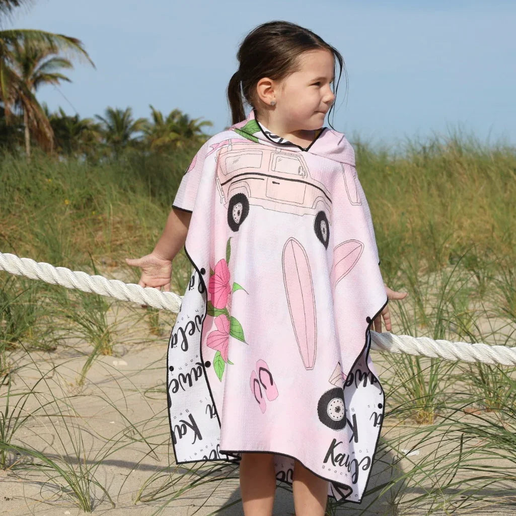 Poncho enfant KAWELÄ LAHAINA avec motif coloré, tissu imperméable, porté par un enfant, face avant, style pratique et élégant.