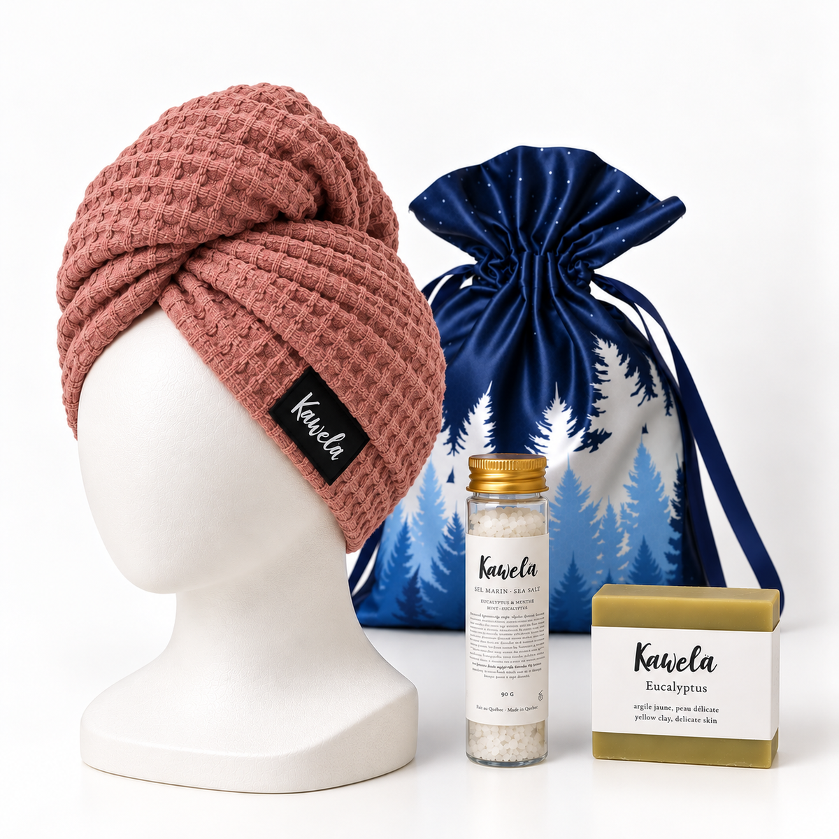 Coffret cadeau bien-être Kawelä avec produits de spa présentés en composition naturelle