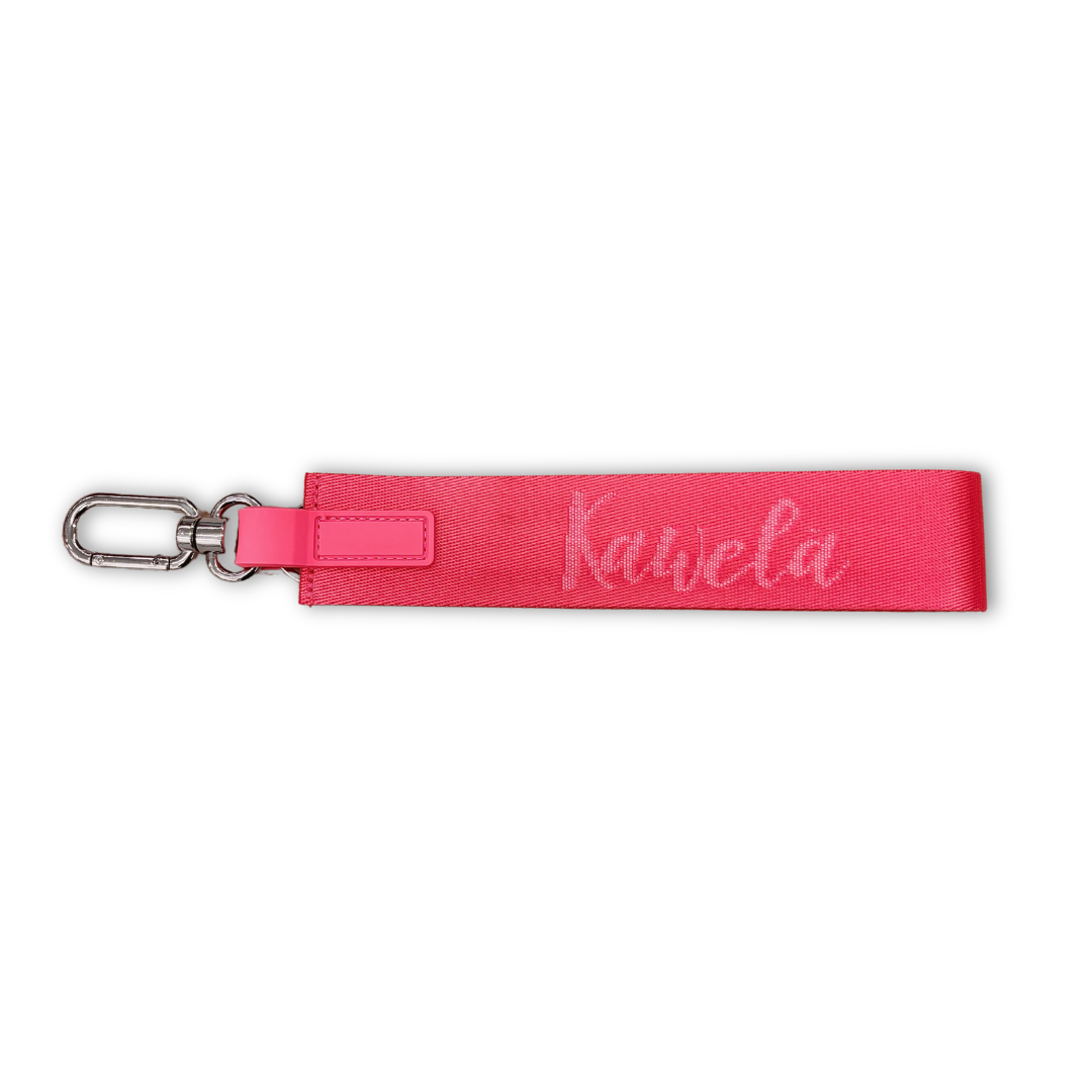 Porte-clé en forme de seau rose de la marque KAWELÄ, avec design coloré et détails attrayants.