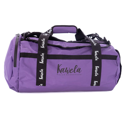 Sac de voyage mauve Coachella de la marque Kawelä, avec poignées et compartiments visibles.