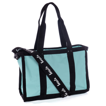 Sac fourre-tout KAWELÄ COZUMEL 25L en tissu sarcelle, avec poignées et espace pour accessoires, vue de face.