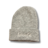 Tuque KAWELÄ en laine douce, portée sur une tête, avec un style chaud et confortable, couleur neutre, mode hivernale.